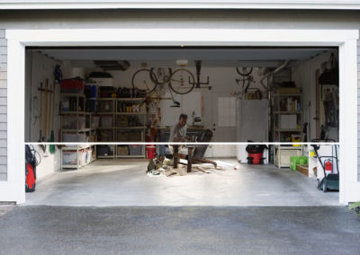 oasis-man-working-in-garage